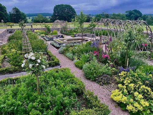 a garden with many different types of plants at Buittle Castle Exclusive Use- Stay in your own Castle! in Castle Douglas