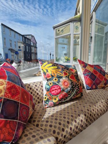 a couch with pillows sitting on a window sill at The Bosworth House Hotel in Blackpool