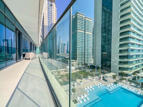 an apartment balcony with a view of a city at HiGuests - Superlative apt with private beach access in Dubai