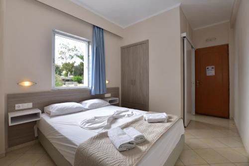 Posteľ alebo postele v izbe v ubytovaní Flisvos Rooms