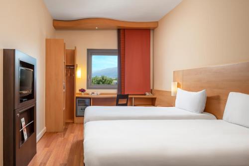 Cama ou camas em um quarto em Ibis Bursa