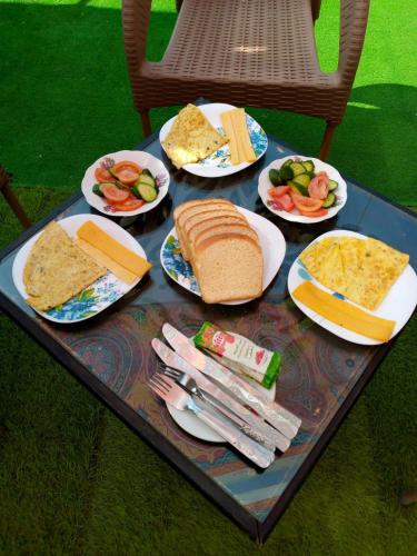 a tray with plates of food on a table at Castle Hotel in Cairo