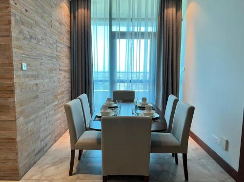 a dining room with a table and chairs at Fairview Luxury Apartments in Dar es Salaam