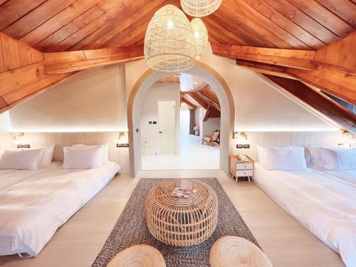 Voodi või voodid majutusasutuse Cingjing Florence Resort Villa toas