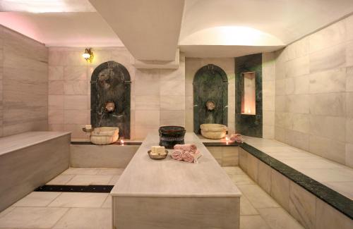 a large bathroom with two toilets in a building at Legacy Ottoman Hotel Istanbul Old City in Istanbul
