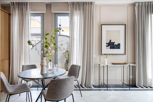 a dining room with a table and chairs at Ayala 63 - THE ARC COLLECTION in Madrid