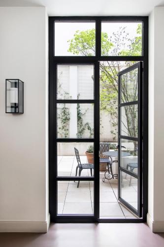 an open door with a view of a patio at Ayala 63 - THE ARC COLLECTION in Madrid