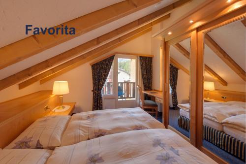 Postel nebo postele na pokoji v ubytování Swissflair Apartments
