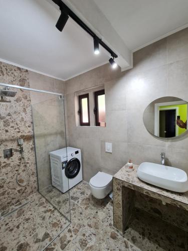 a bathroom with a shower and a toilet and a sink at Stefanelo in Ulcinj