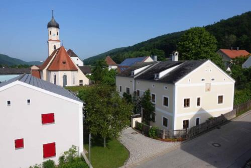 an aerial view of a small town with a church at Fewo Lehner in Riedenburg