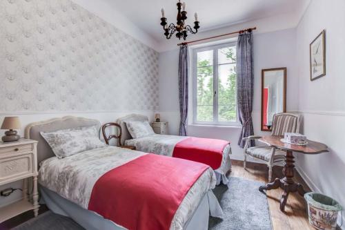 Postel nebo postele na pokoji v ubytování Chateau de Pourpry
