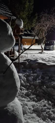a pile of snow on the side of a street at Leśniczówka Kalina in Wetlina