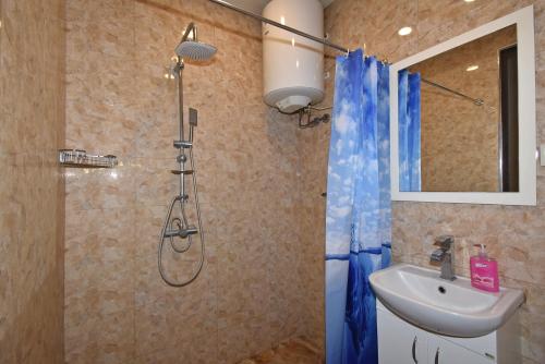 a bathroom with a shower and a sink at Apartment Koryun 1 in Yerevan