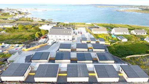 a large building with a lot of windows on the side of it at Aran Islands Hotel in Kilronan