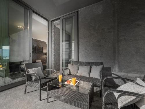 a living room with a couch and chairs and a table at Royal Montesun Apartments in Budva