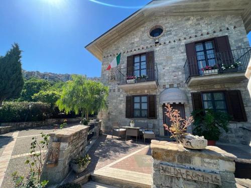 a large stone building with a patio in front of it at Villa Romina esclusive cottage Gissi in Gissi