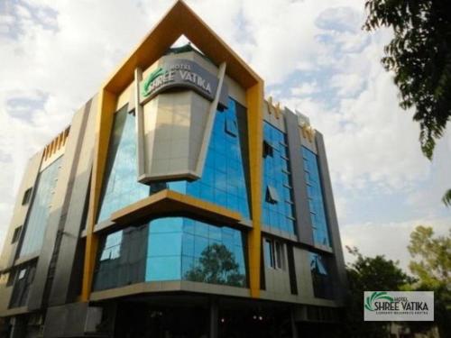 a building with a light on the top of it at Hotel Shree Vatika in Bhopal