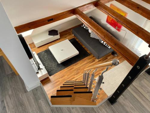 an overhead view of a living room with a spiral staircase at Das Nest am Park in Lemgo