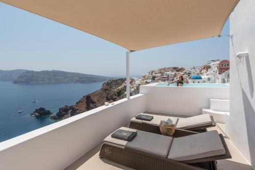 a balcony with a view of the ocean at Aspaki by Art Maisons in Oia