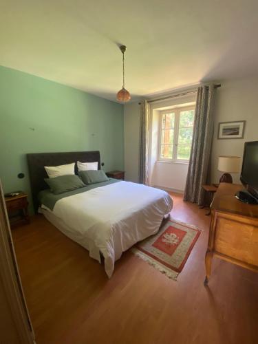 Ένα ή περισσότερα κρεβάτια σε δωμάτιο στο Villa & Spa dans le Périgord