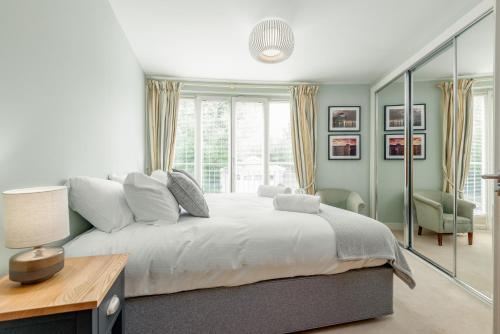 a bedroom with a large bed and a window at The Argyle Apartment - Luxury - Parking in St Andrews