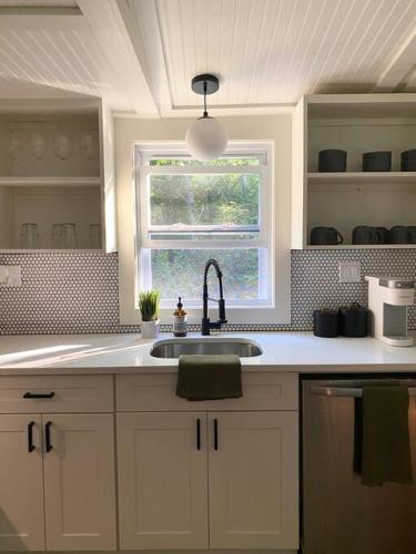 a kitchen with a sink and a window at The Cabin @ Benton Hollow in Livingston Manor