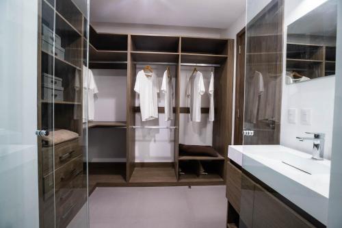 a bathroom with a sink and a mirror at NIU Modern Apartments near WTC & Condesa - Roma Sur in Mexico City