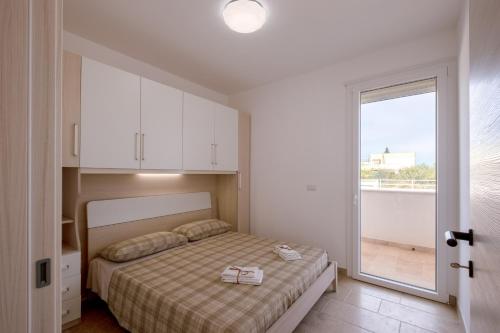 Postel nebo postele na pokoji v ubytování Villa Bianca