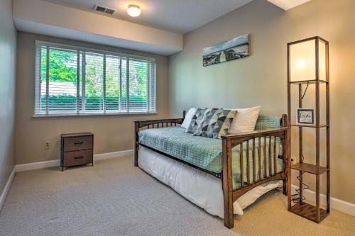 a bedroom with a bed and a window at Sunny South Haven Condo Less Than 1 Mi to Beaches! in South Haven