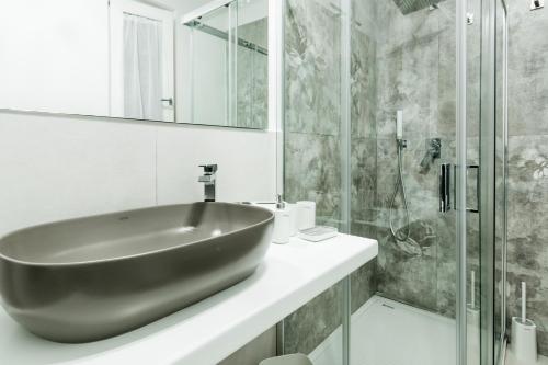 a bathroom with a black sink and a shower at Le Isole di Anita in Lipari