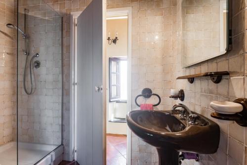 a bathroom with a sink and a shower at Nearby 5 Terre Lovely Mansarda in Carrodano Inferiore