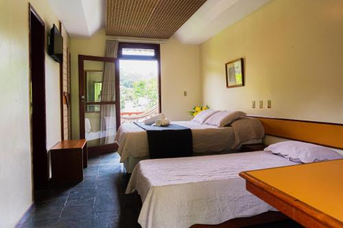 Ένα ή περισσότερα κρεβάτια σε δωμάτιο στο Hotel Vale do Jiquiriçá