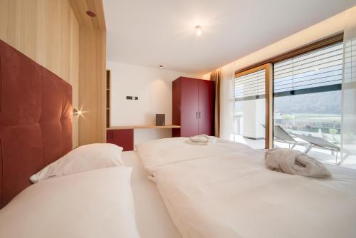 Katil atau katil-katil dalam bilik di Residence & Sportlodges Claudia