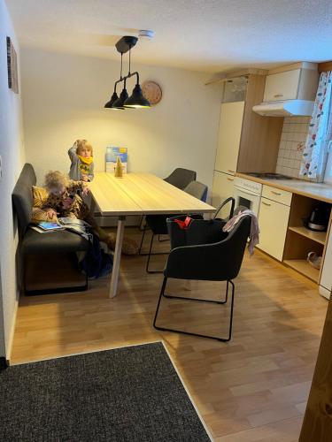 a kitchen and dining room with a table and chairs at Ferienwohnung Jäger in Kappl
