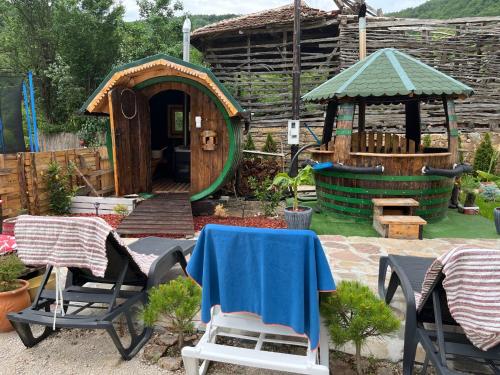 a garden with a play house and a gazebo at VILA MILICA & SPA ALEKSANDRA in Dimitrovgrad