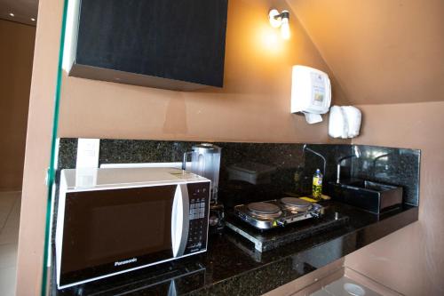 A kitchen or kitchenette at Village Barra Hotel