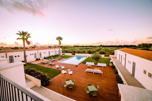 an aerial view of the courtyard of a house with a swimming pool at Baglio Custera in Marsala