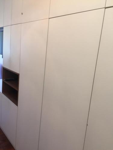 a white cupboard in a room with a bed at Merazur in Fréjus