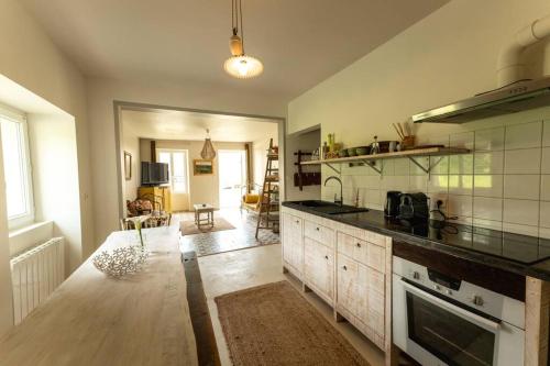 a kitchen with a counter and a stove top oven at Countryhome at winery Chateau Camponac in Bourg-sur-Gironde