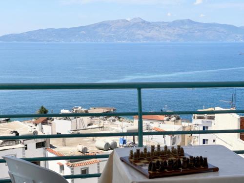 a view of the ocean from a balcony at Ernest Apartments in Sarandë