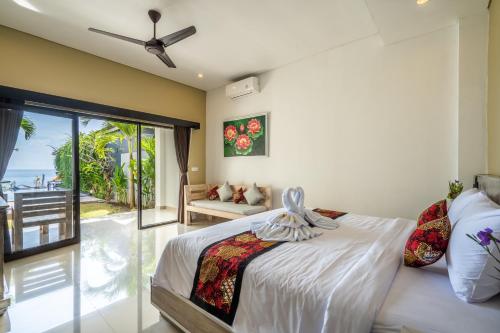 Ein Bett oder Betten in einem Zimmer der Unterkunft Mejore Beach Hotel