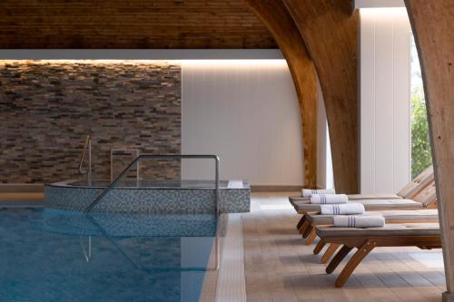 a room with a glass table and some chairs at Loch Fyne Hotel & Spa in Inveraray