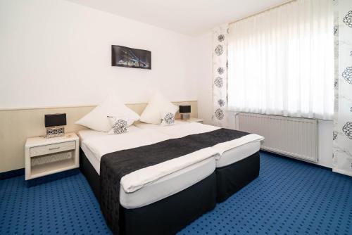 Una cama o camas en una habitación de Hotel Papenbreer