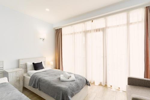 Cama o camas de una habitación en G-Point New Beach