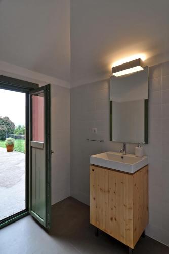 a bathroom with a sink and a mirror at Quinta do Santinho in Amarante