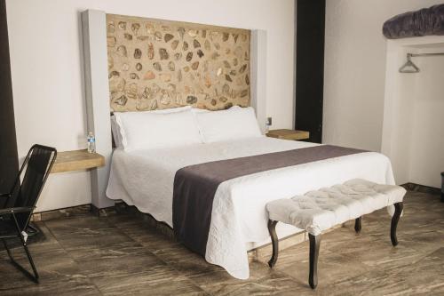 Postel nebo postele na pokoji v ubytování Hotel Nuevo Bernal