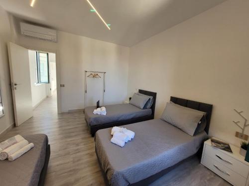 a living room with two beds in a room at Sara luxury apartment 3 in Sorrento