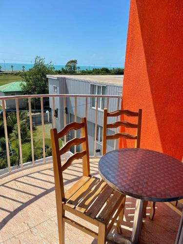 two chairs and a table on a balcony at Hotel Georgia in Gonio