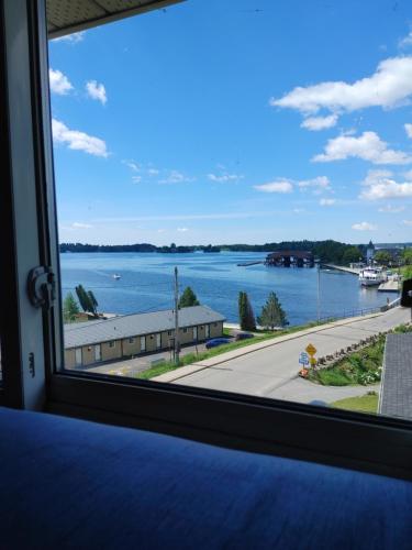 a view of the water from a window at Stonewater Manor B&B in Gananoque
