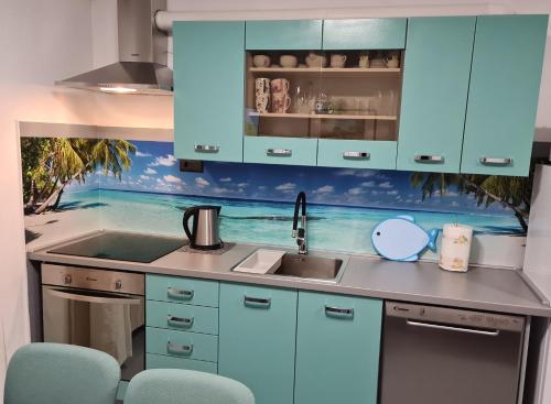 A kitchen or kitchenette at Villa Rosa with yard and children's playground